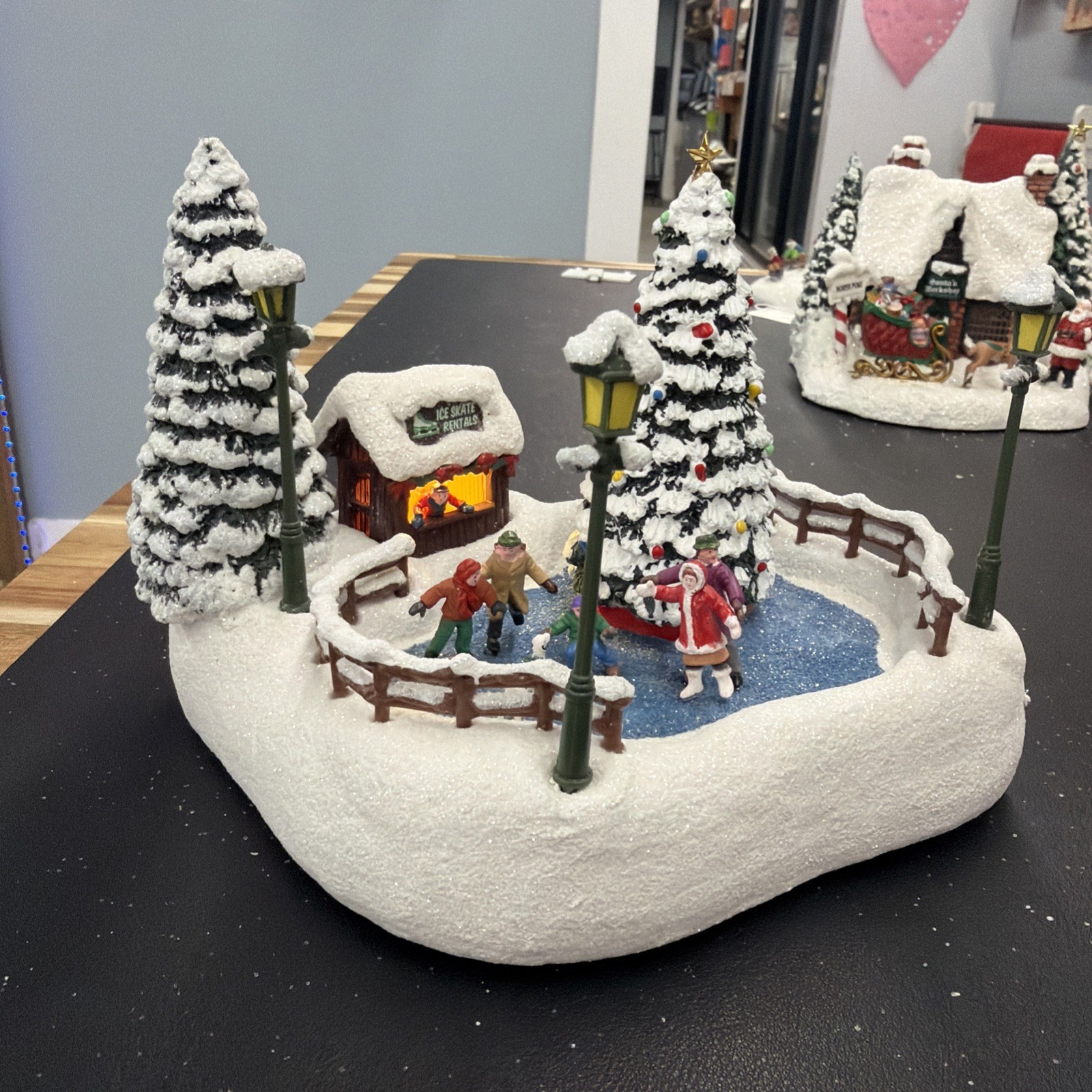 2024 Thomas Kinkade Teleflora 2024 Oh What Fun Christmas Village Ice Rink