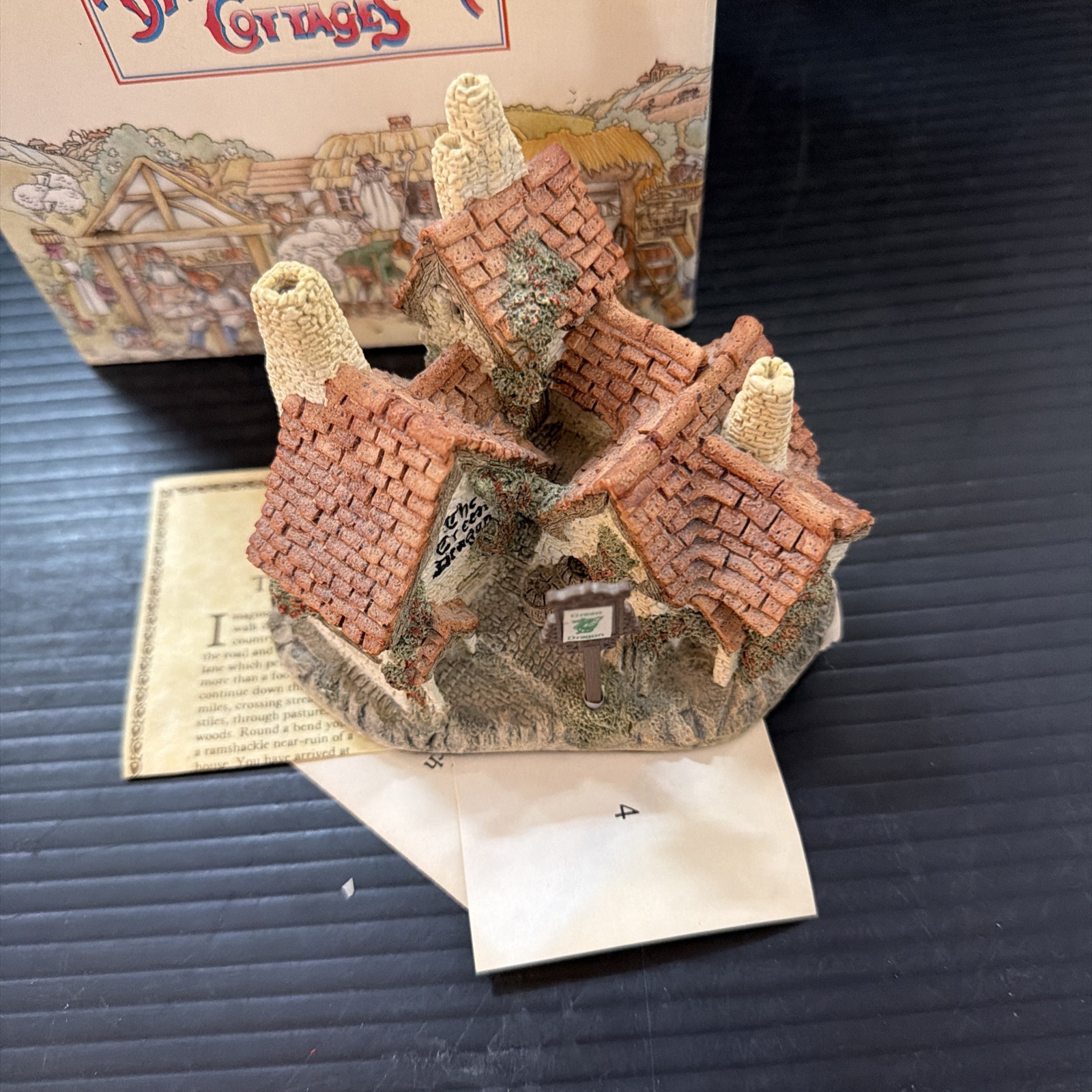 Green Dragon Pub by David Winter (1983) with original plastic sign
