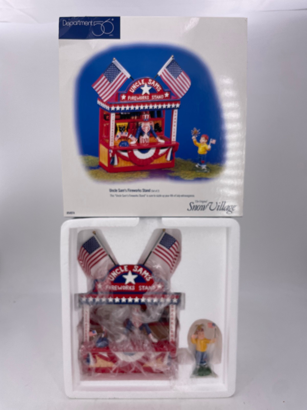 Department 56-Snow Village – Uncle Sam’s Fireworks Stand (8″) – 54974