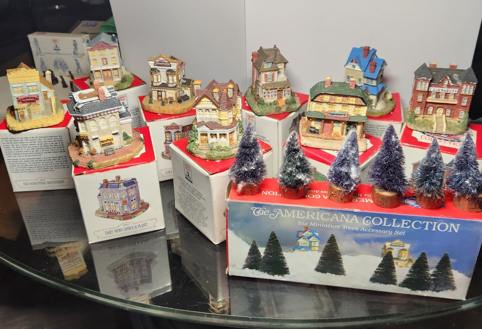 The AMERICANA COLLECTION LIBERTY FALLS MINIATURE VILLAGE AMD PEWTER FIGURINES