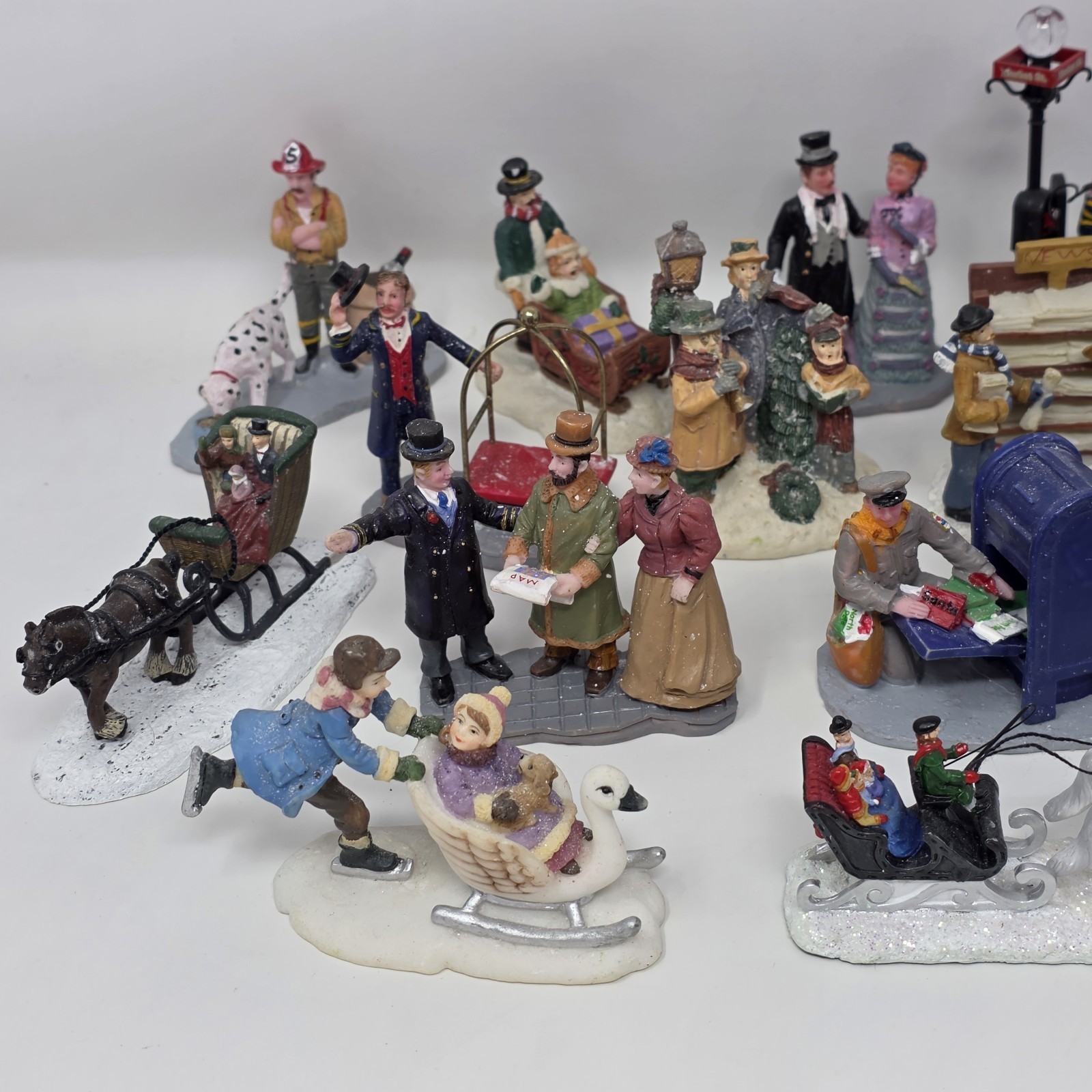 Lot of 19 Larger Resin Christmas Village Figurines Measuring 1” to 3” In Height