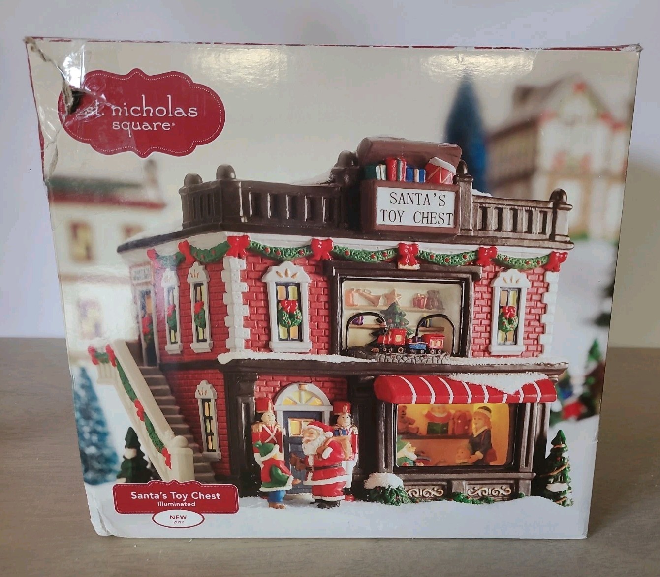 St. Nicholas Square Christmas Village 2010 Santa’s Toy Chest Illuminated W/Box