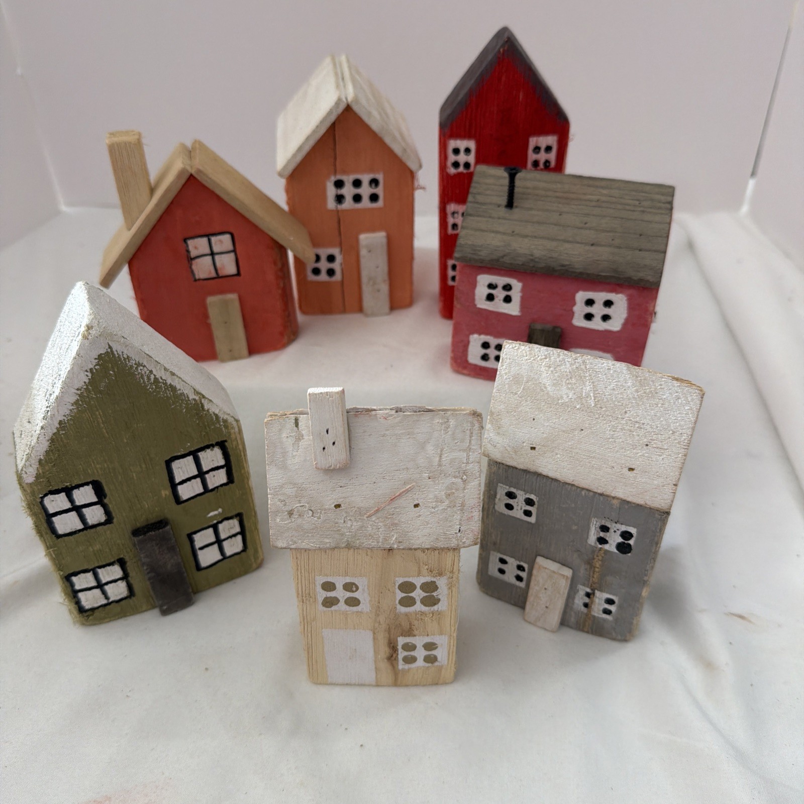 7 small wooden village houses, 3-6” Creative C-Op, Inc. Sold By Dresden & Co.
