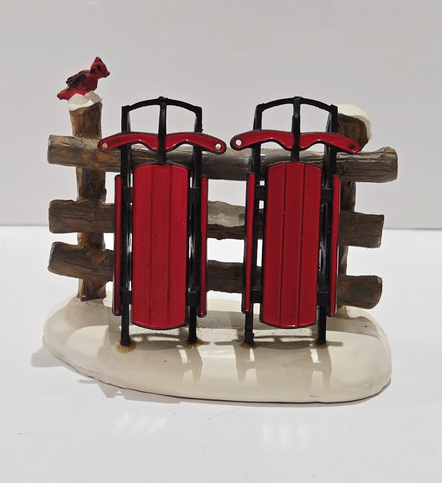 LEMAX Christmas Village Red Sleds In Snow By Fence 3″ x 2.5″ Cute Collectible!