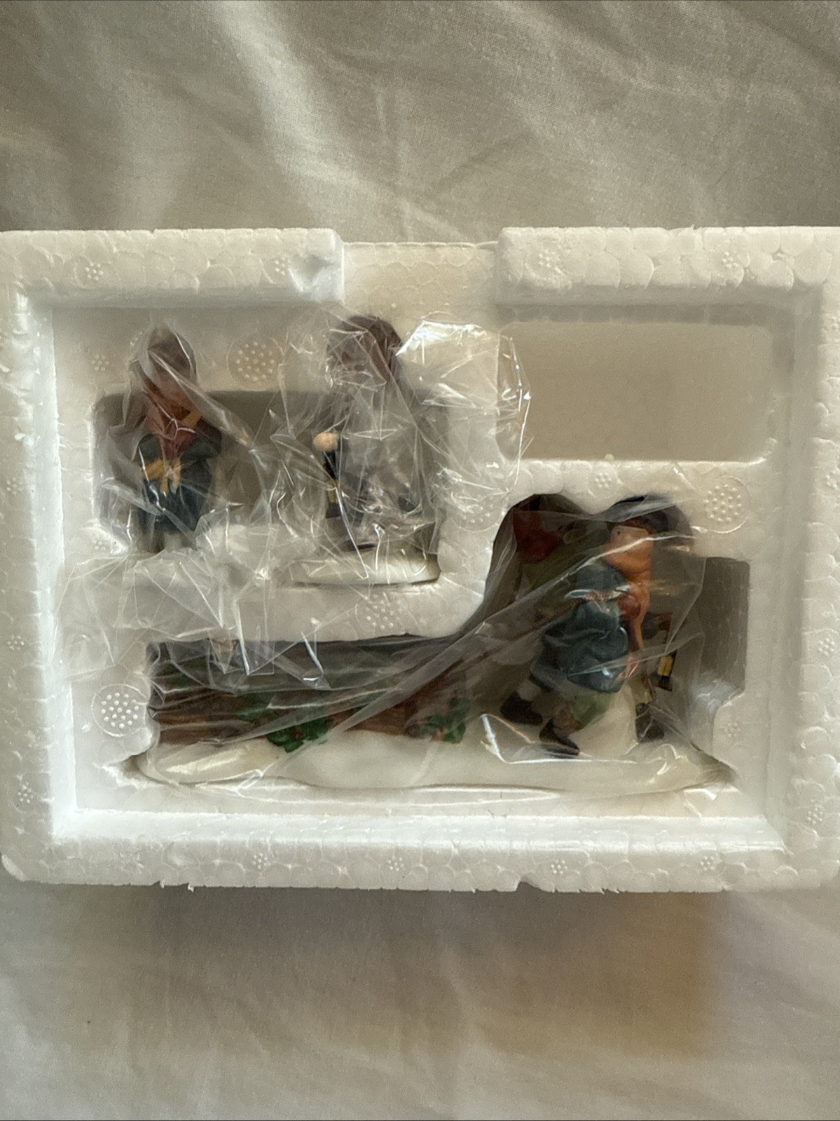 Department 56 Heritage Village Collection Bringing Home the Yule Log
