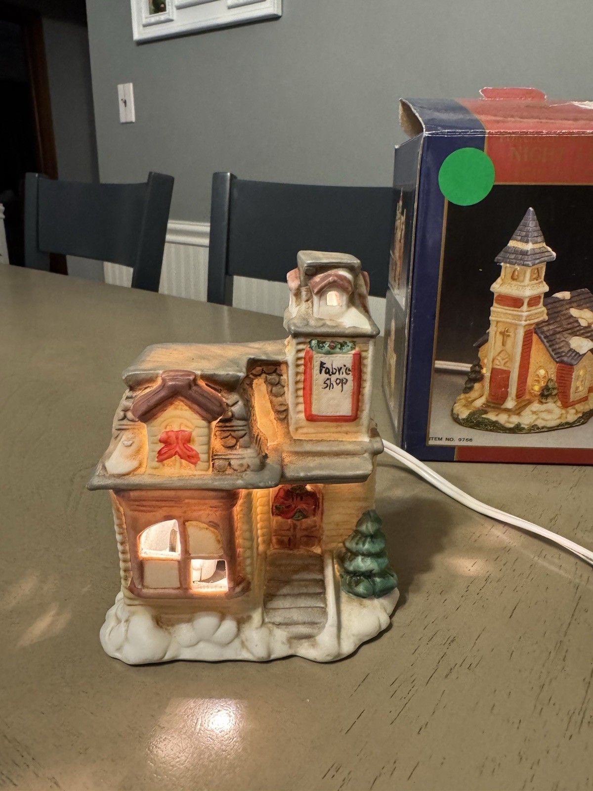 Christmas Porcelain Lighted Fabric Shop w/ Electric Cable 5″tall APEX . No.9766