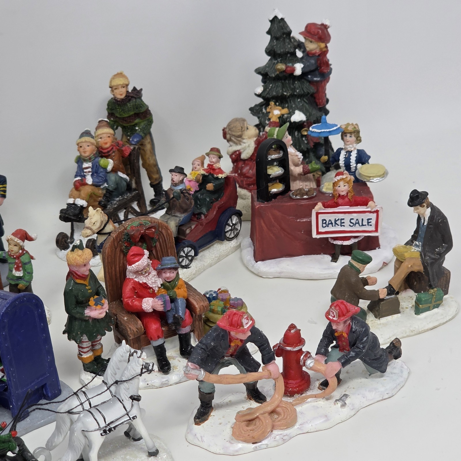 Lot of 19 Larger Resin Christmas Village Figurines Measuring 1” to 3” In Height