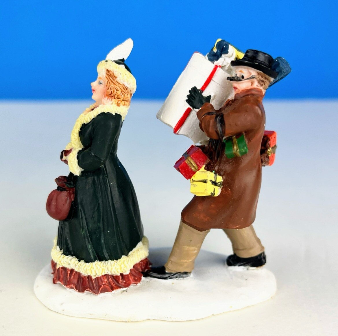 Couple with Stacked Shopping Gifts Boxes Handpainted Christmas Village Figurine