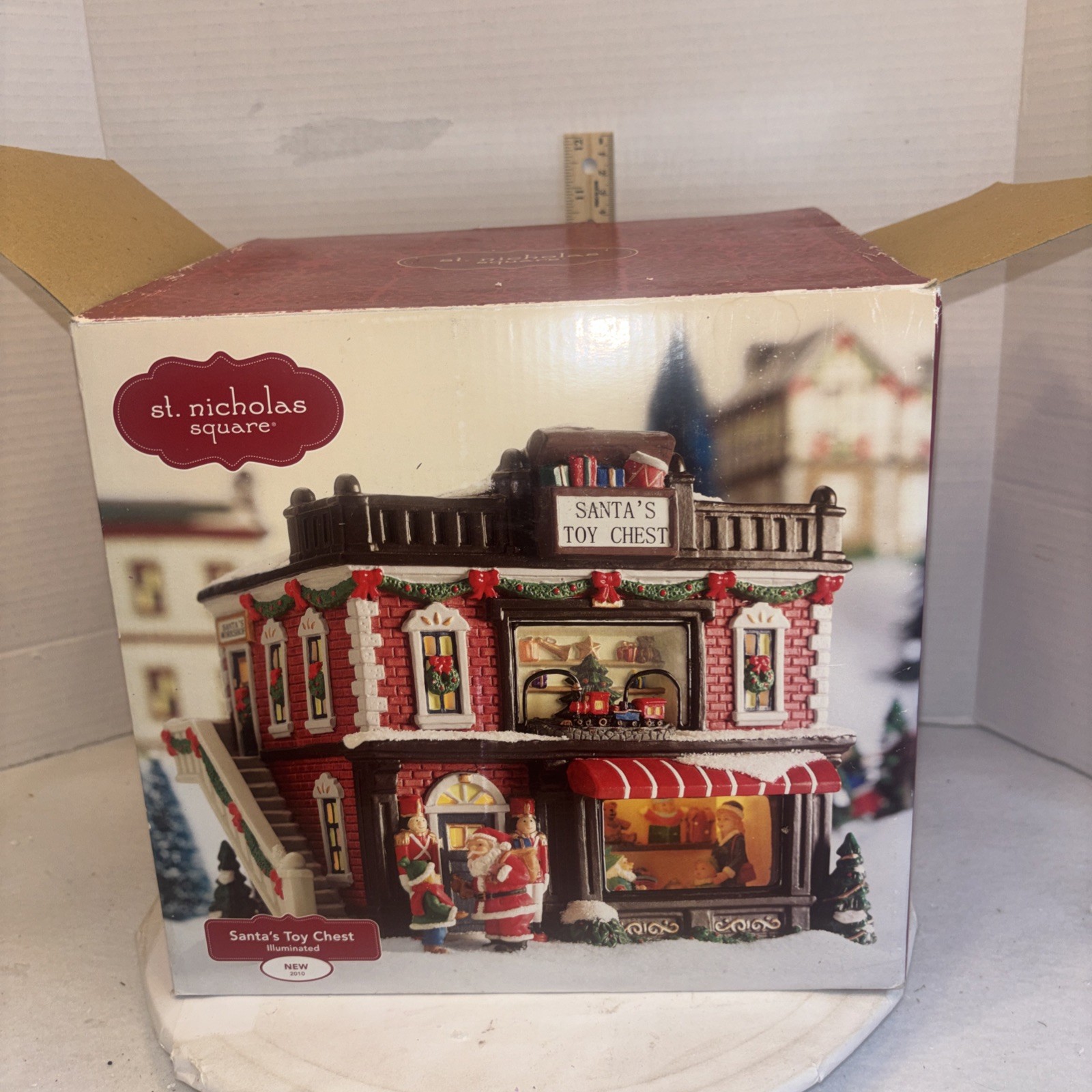 2010 St Nicholas Square Christmas Village Santa’s Toy Chest Illuminated