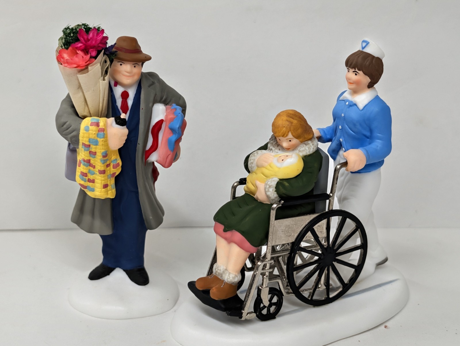 DEPT 56 “Christmas In The City” – BRINGING HOME THE BABY Christmas Village