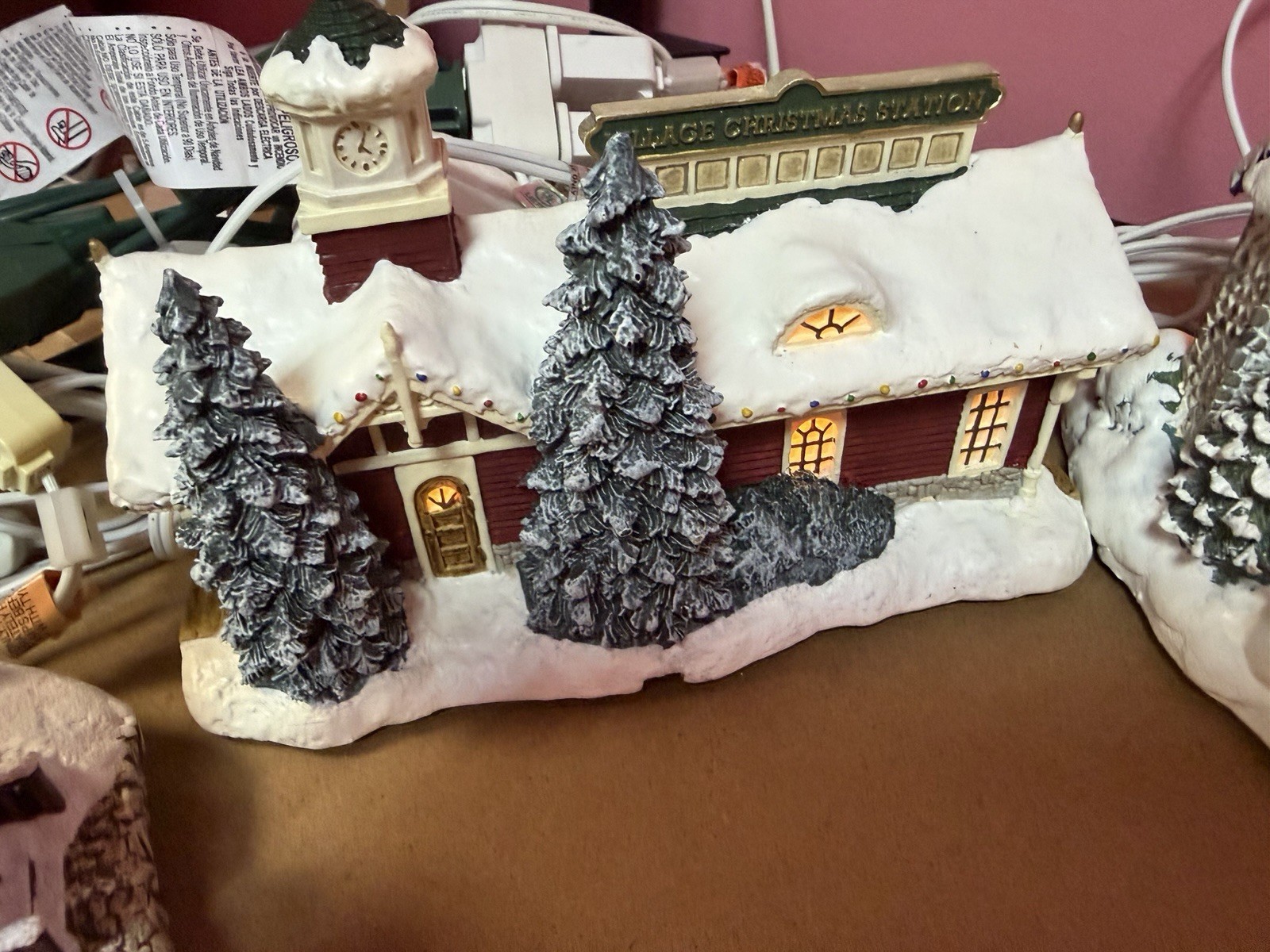 Thomas Kinkade’s Village Christmas Four Pieces collection by Hawthorne Village