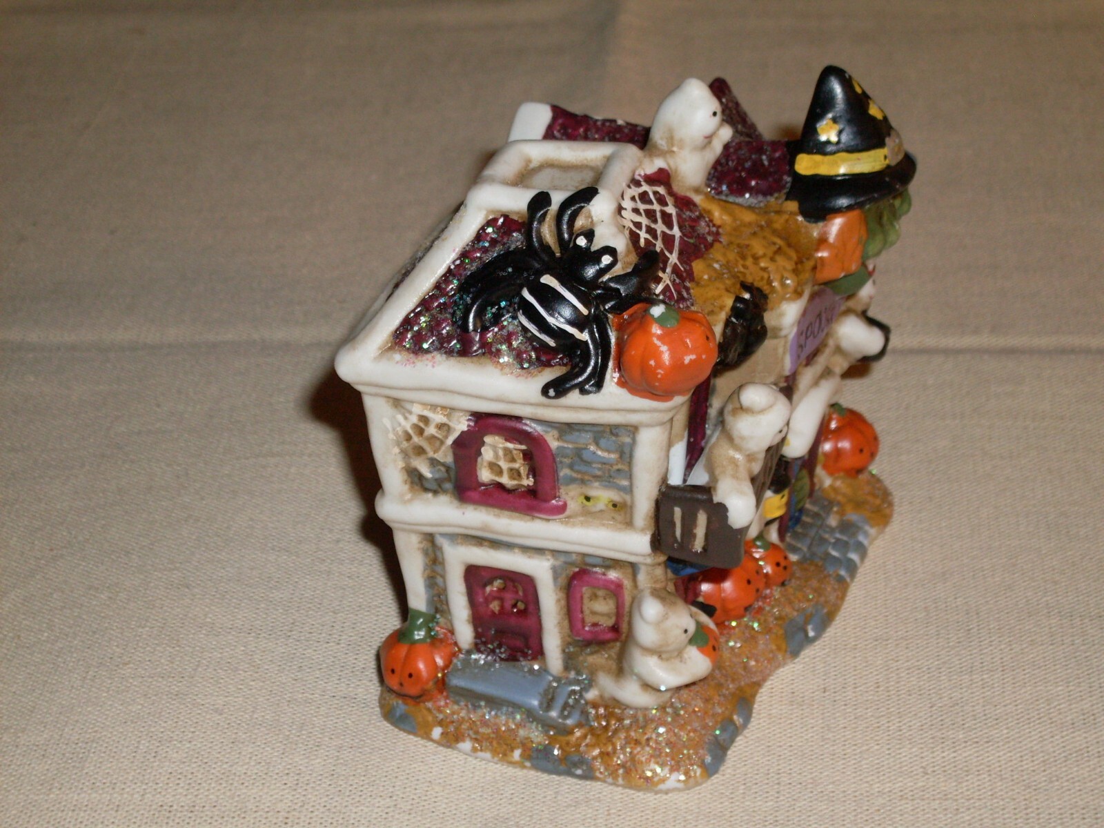 Village Houses. Five colorful, detailed ceramic pieces for display. 4″ tall