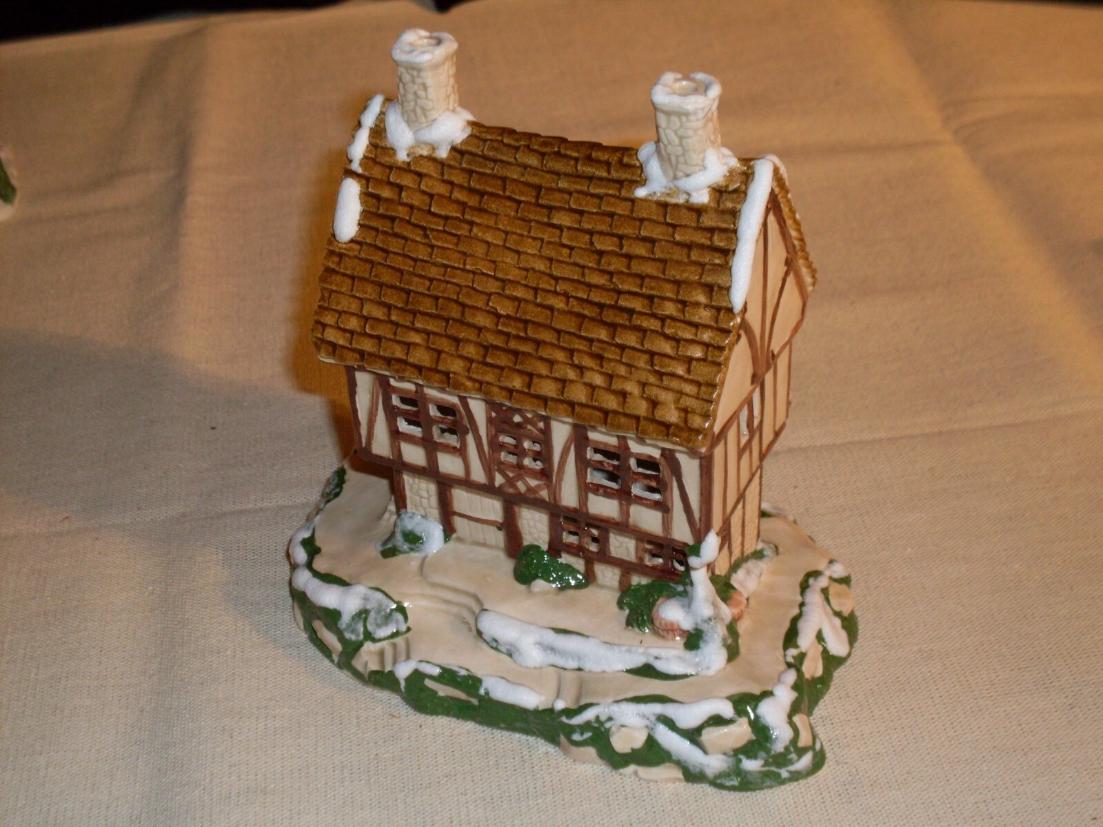Village Houses. Five colorful, detailed ceramic pieces for display. 4″ tall