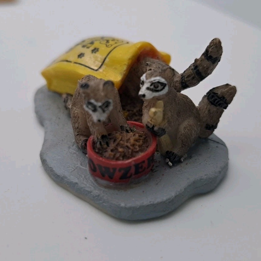 Lemax Christmas Village Thievery #24498 Racoons Eating Dog Food Yellow Bag