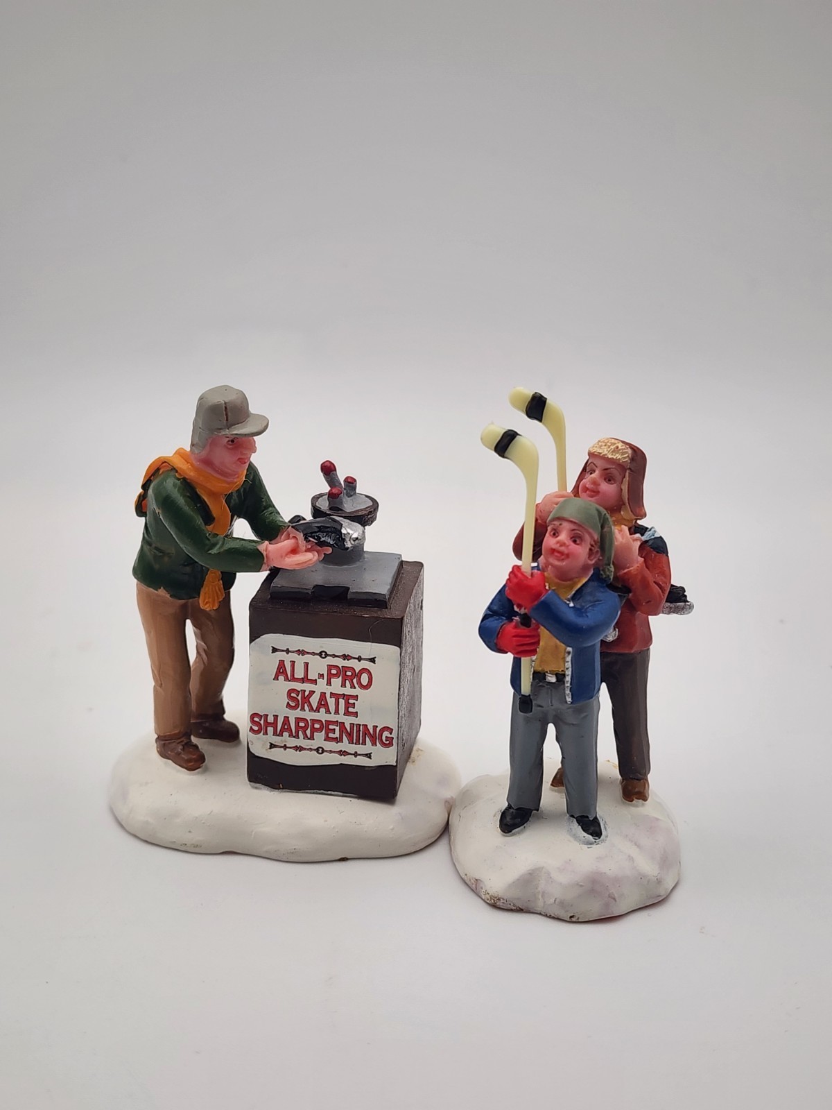 Christmas Village Accessories Skate Sharpener Hockey Boys Lemax Village Set of 2
