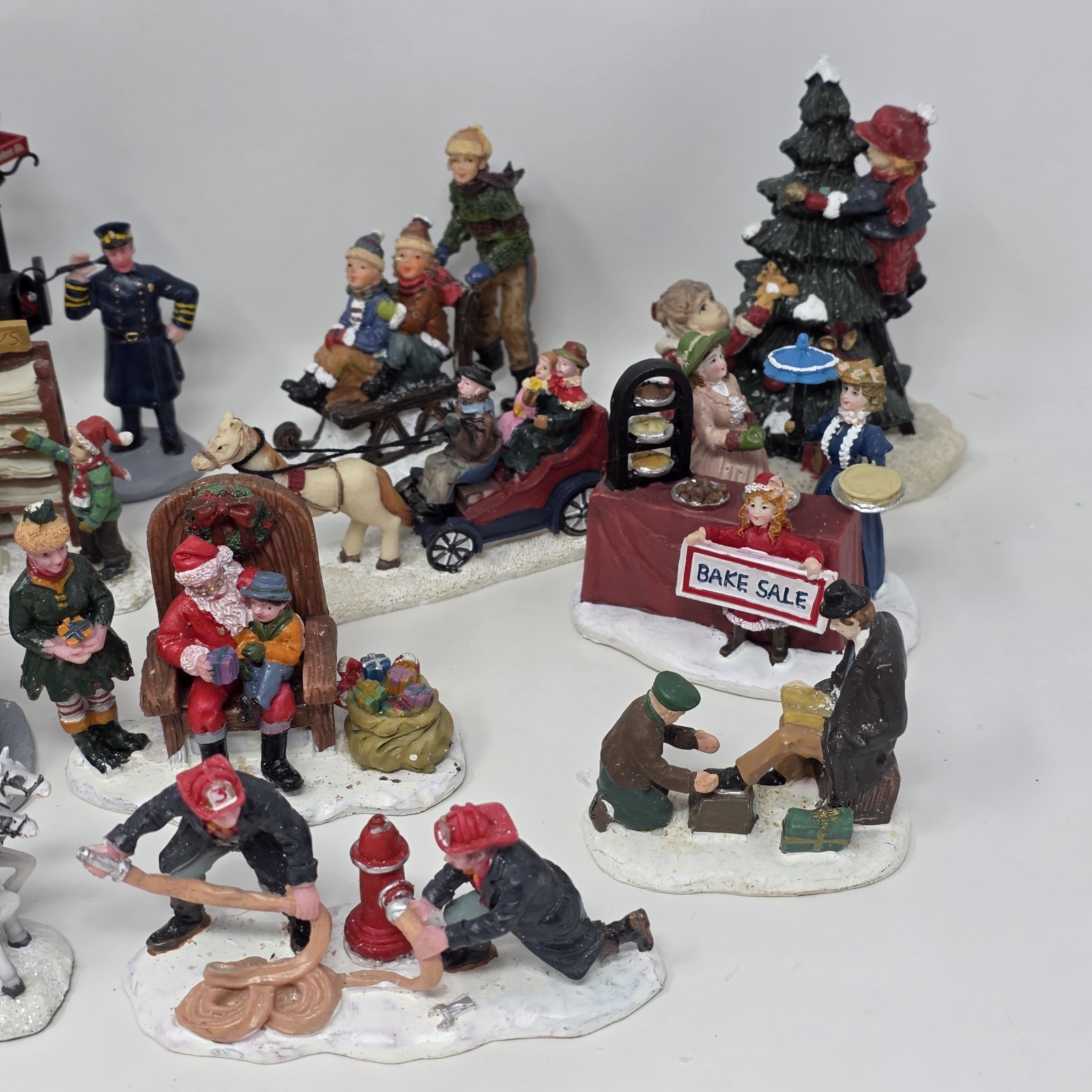 Lot of 19 Larger Resin Christmas Village Figurines Measuring 1” to 3” In Height