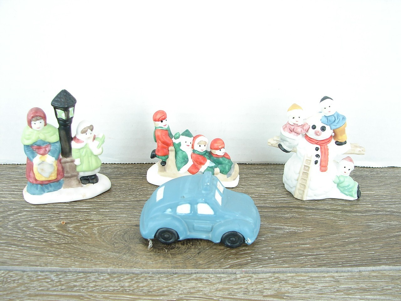 VTG Christmas Snow Village Figures/Lot of 4/Car/ Carolers/ sleigh ride/ snowman