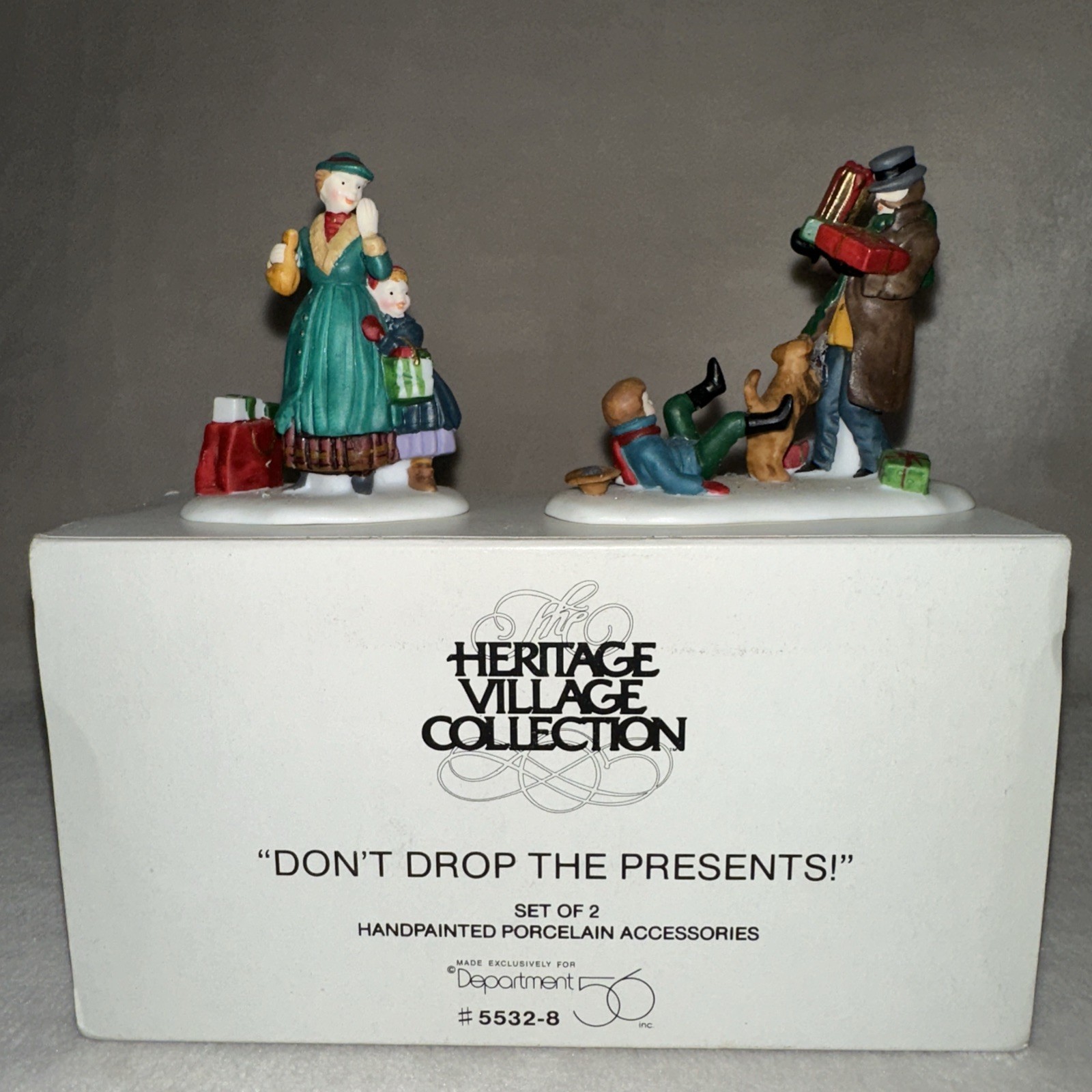 Dept 56 Heritage Village Collection Don’t Drop the Presents – Set of 2 – 55328