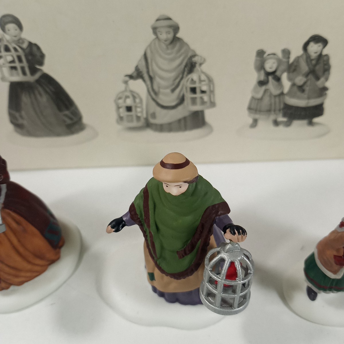 Dept 56 Heritage Village Lot Of 2 The Bird Seller & Welcome Home Figure Sets