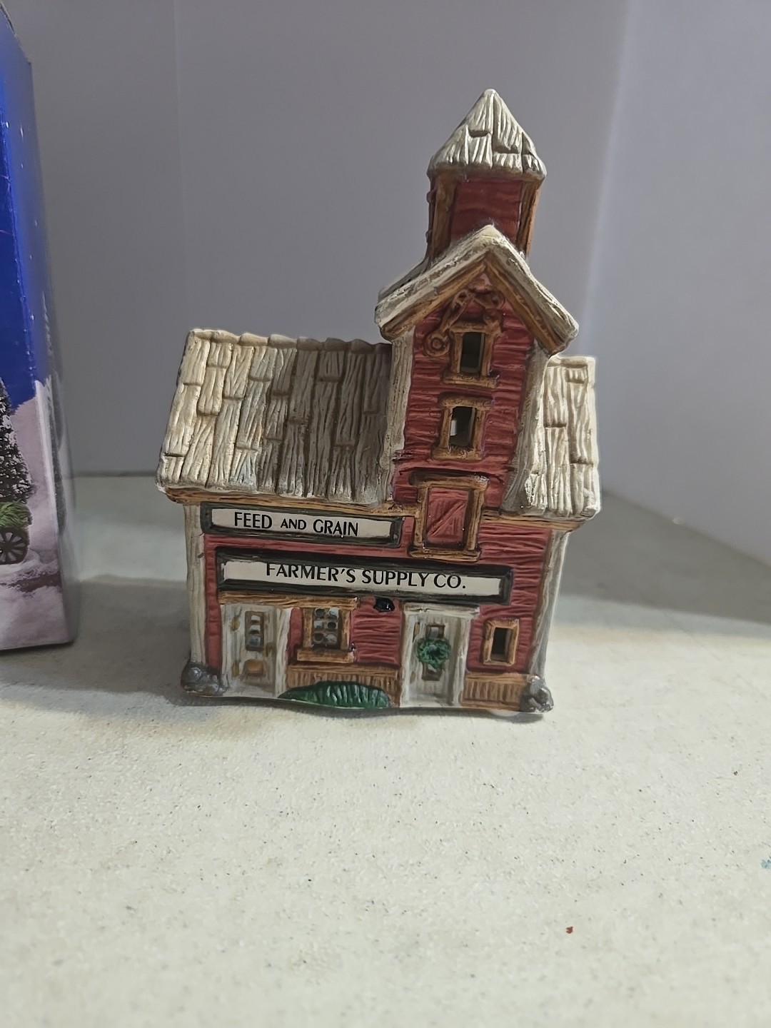 Home Town America Porcelain Home Town Feed and Grain. 1995. 5″ Tall.