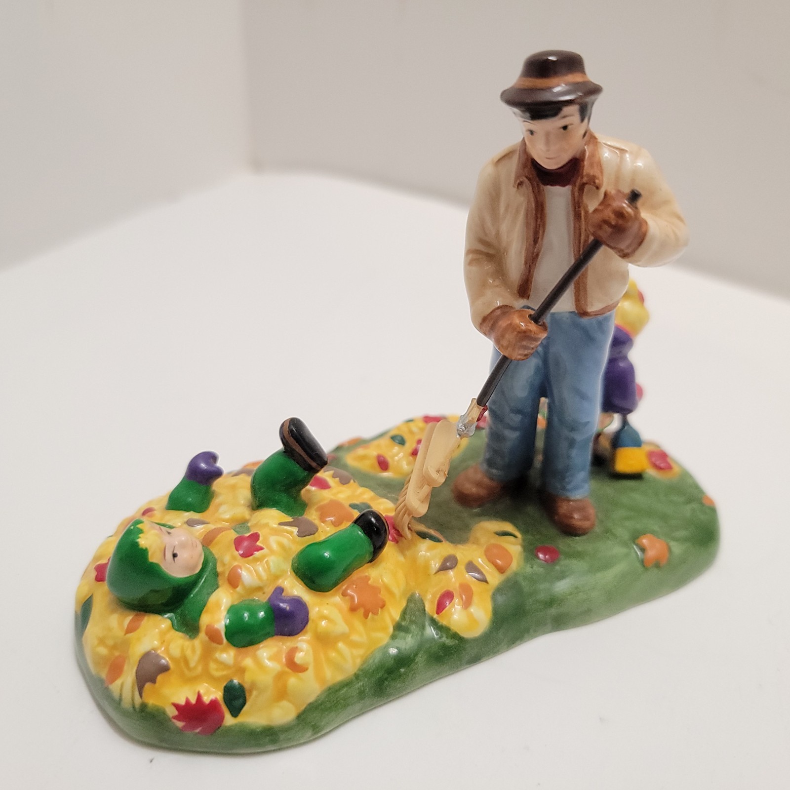 DEPT 56 1 Figure PREPARING FOR HALLOWEEN SNOW VILLAGE 54982 Raking Leaves Child