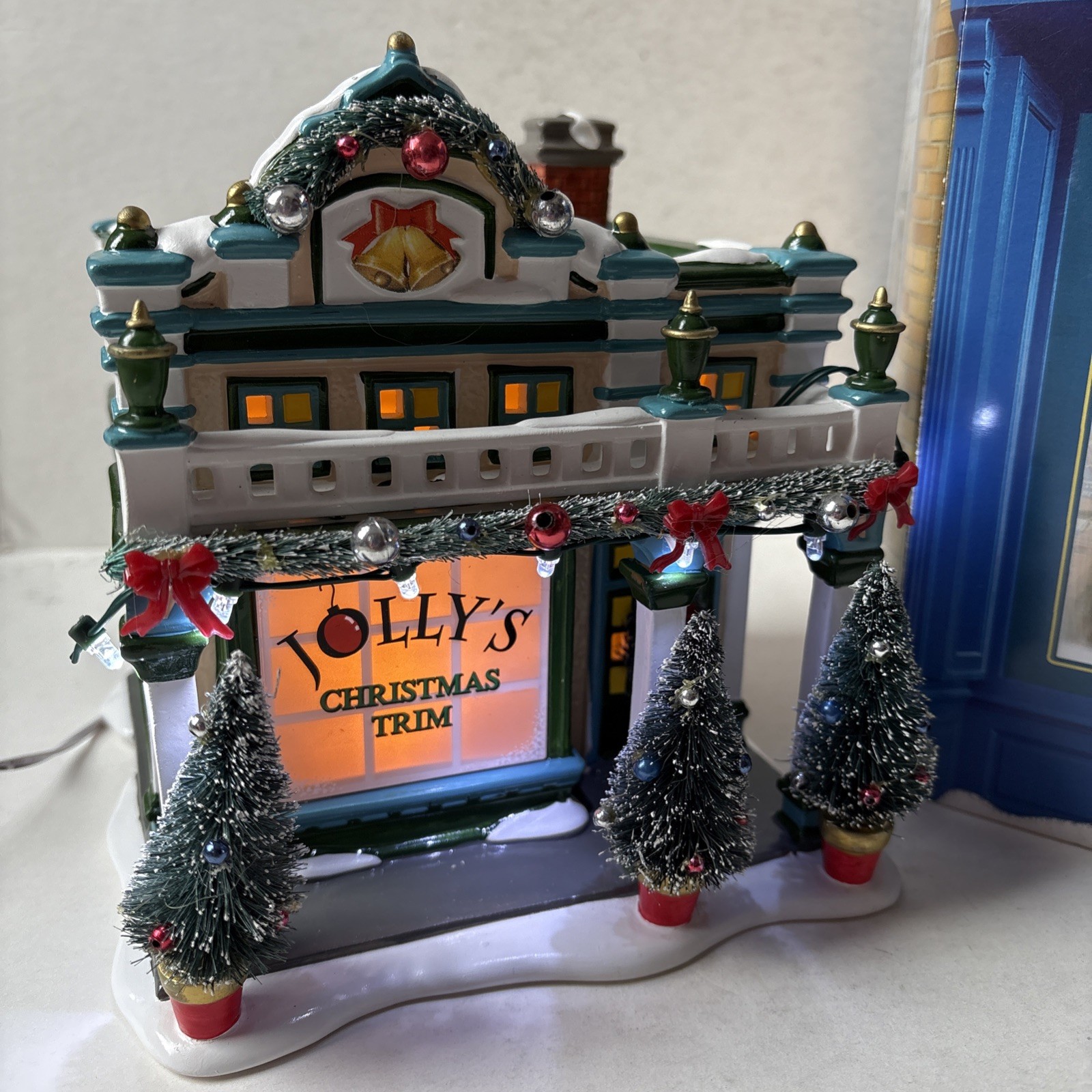 Dept 56 Light & Music 4049208 Sounds of Christmas Snow Village Jolly’s Trim Shop