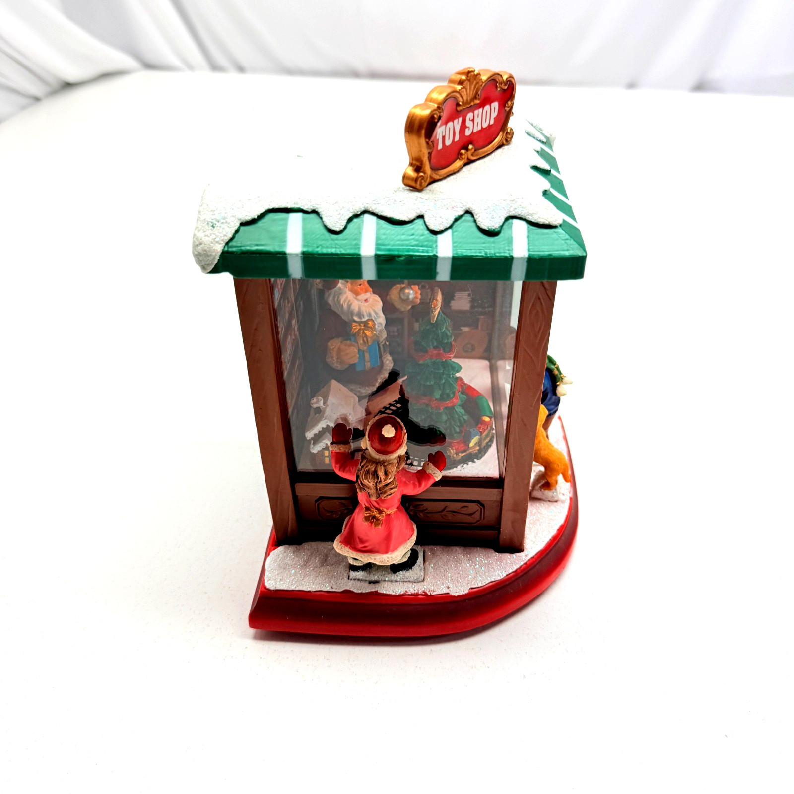 MOMENTS IN TIME Lighted Santa’s Toy Shop (Needs Battery Spring Replaced)
