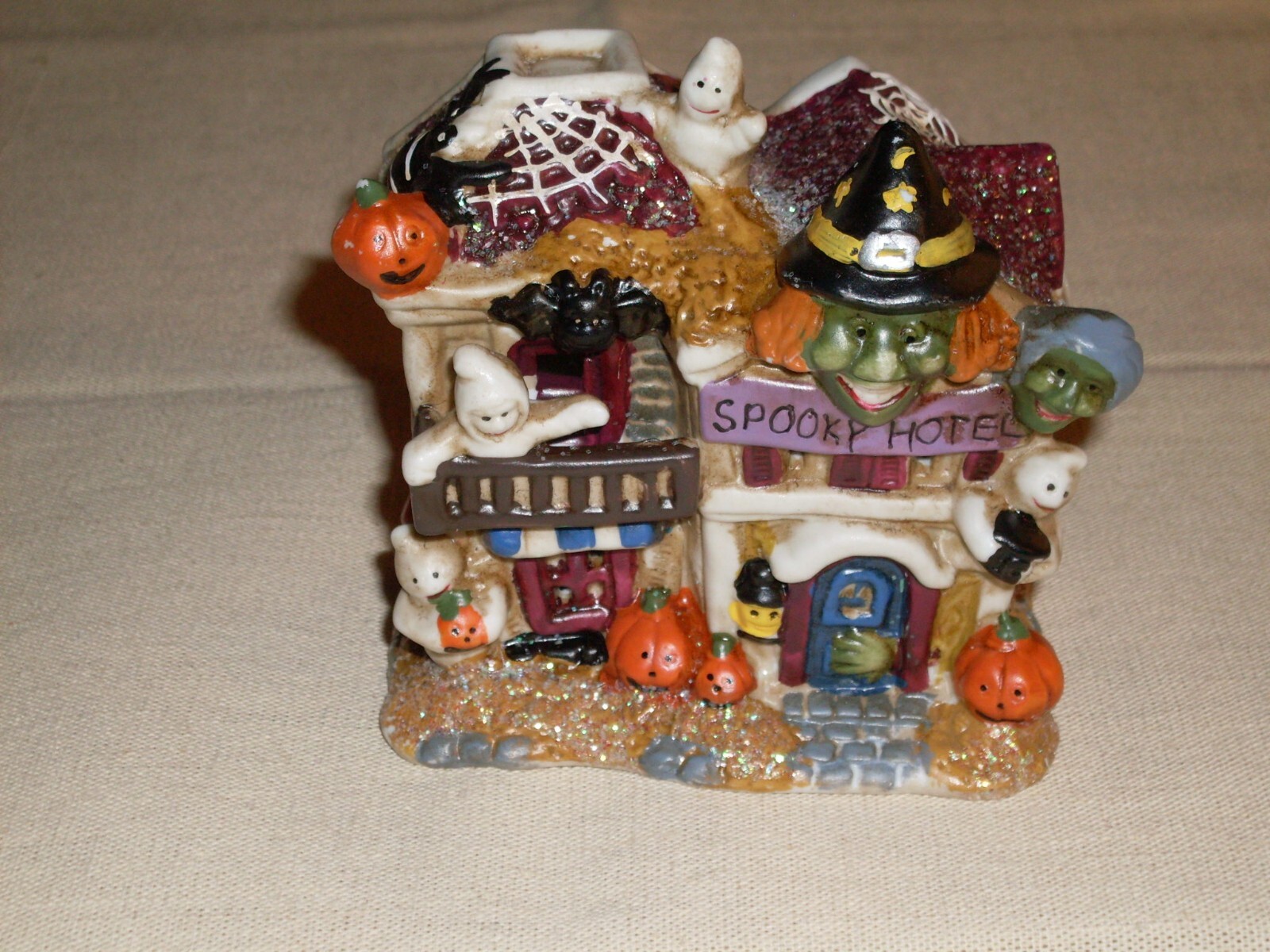 Village Houses. Five colorful, detailed ceramic pieces for display. 4″ tall