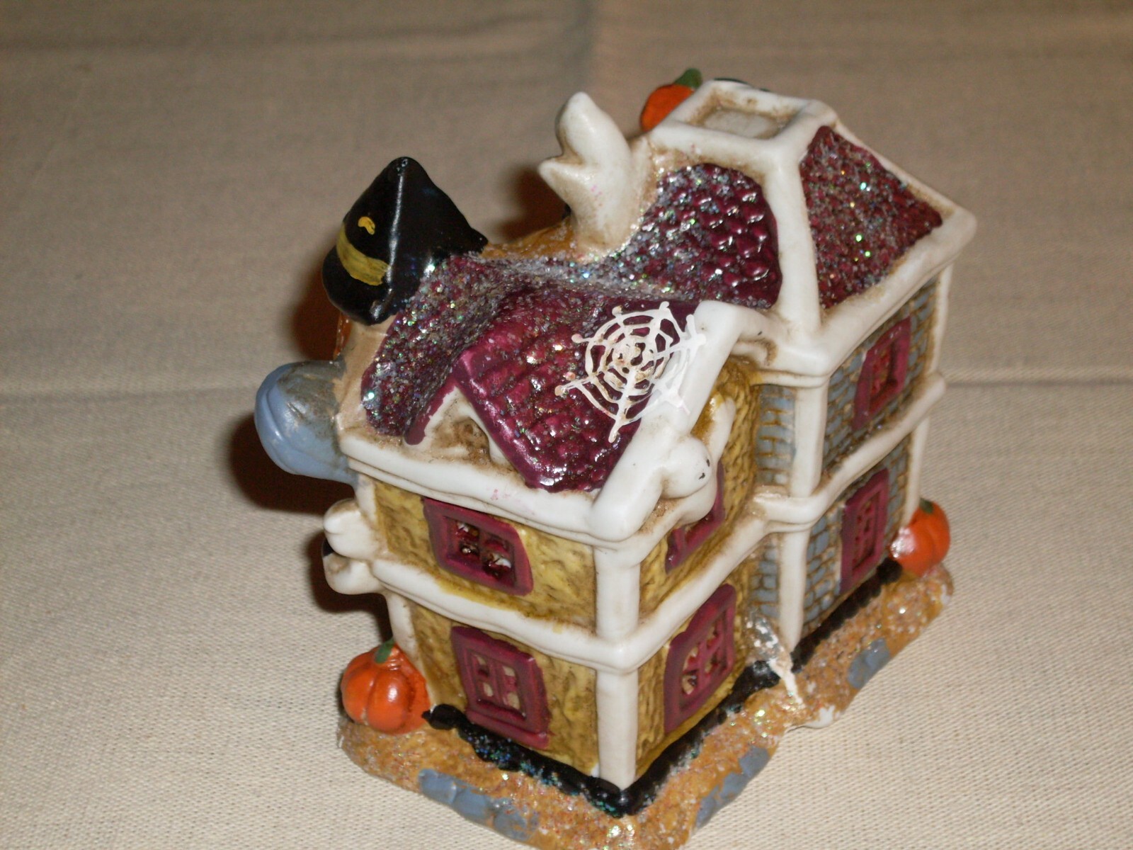 Village Houses. Five colorful, detailed ceramic pieces for display. 4″ tall