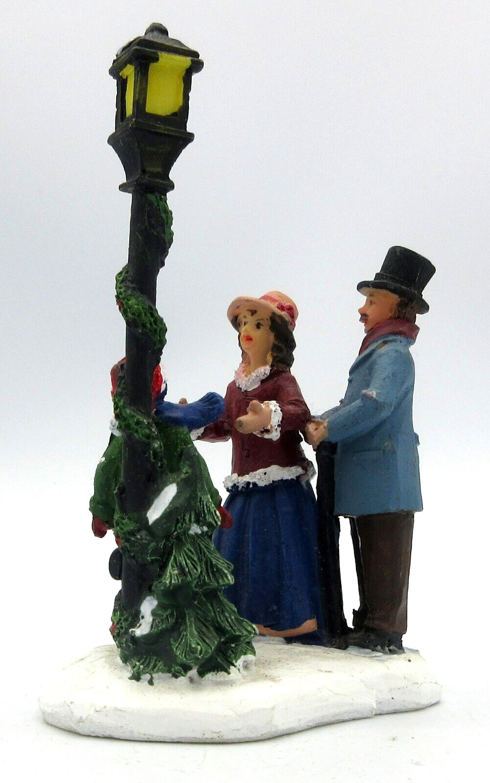 Christmas Village Miniatures Family Under the 3 1/2 Inch Light Pole Unbranded