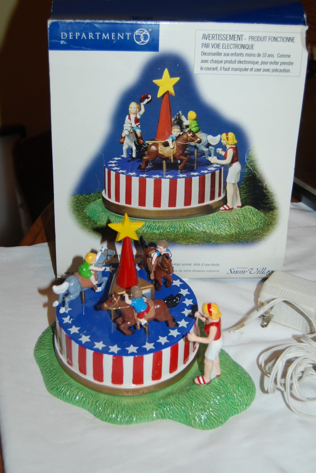 Dept 56 Snow Village Series MERRILY ROUND WE GO – lights up – not spinning